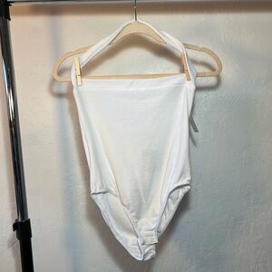 Womn White Cotton Body Suit
Size L 
Size runs smaller
NEW WITH TAGS
